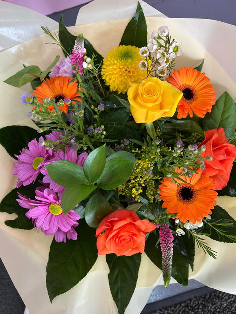 A hand-tied bouquet of seasonal blooms made at Primrose & Poppies in Blackley, Manchester